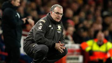 (FILES) In this file photo taken on January 6, 2020 Leeds United's Argentinian head coach Marcelo Bielsa watches from the touchline duirng the English FA Cup third round football match between Arsenal and Leeds United at The Emirates Stadium in London. - For a man nicknamed 'El Loco' (mad man) and with little silverware in his long managerial career, Marcelo Bielsa is an unlikely hero to a younger generation of coaches. However, hordes of Leeds fans will now treat him with similar reverence after he guided one of English football's sleeping giants back to the Premier League after a 16-year wait. (Photo by Adrian DENNIS / AFP)