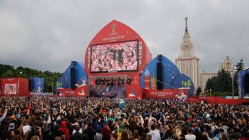 People attend the official opening ceremony of the FIFA Fan Fest in Moscow, near the main building of the Lomonosov Moscow State University (MSU) in Moscow, on June 10, 2018, ahead of the Russia 2018 World Cup.