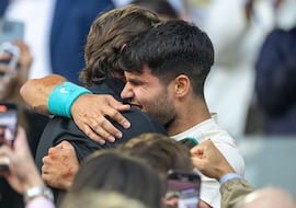 PARIS, FRANCE - JUNE 8: Carlos Alcaraz of Spain embraces coach Juan Carlos Ferrero after his victory against Jannik Sinner of Italy in the Final of the Men's singles competition on Court Philippe-Chatrier during the 2025 French Open Tennis Tournament at Roland Garros on June 8th, 2025, in Paris, France. (Photo by Tim Clayton/Getty Images)