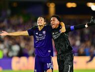 ORLANDO, FLORIDA - SEPTEMBER 07: Rodrigo Schlegel #15 and Pedro Gallese #1 of Orlando City celebrate after Orlando City went up 3-0 against the Sacramento Republic FC in the second half during the Lamar Hunt U.S. Open Cup at Exploria Stadium on September 07, 2022 in Orlando, Florida. Julio Aguilar/Getty Images/AFP