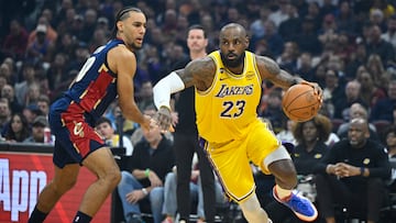 Jan 28, 2026; Cleveland, Ohio, USA; Cleveland Cavaliers guard Jaylon Tyson (20) defends Los Angeles Lakers forward LeBron James (23) in the first quarter at Rocket Arena. Mandatory Credit: David Richard-Imagn Images