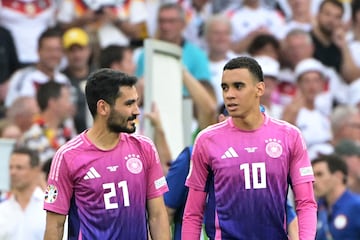 Germany's midfielder #21 Ilkay Gundogan (L) and Germany's midfielder #10 Jamal Musiala celebrate after winning the UEFA Euro 2024 Group A football match between Germany and Hungary at the Stuttgart Arena in Stuttgart on June 19, 2024. (Photo by DAMIEN MEYER / AFP)