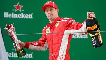 SHANGHAI, CHINA - APRIL 15: Third place finisher Kimi Raikkonen of Finland and Ferrari celebrates on the podium during the Formula One Grand Prix of China at Shanghai International Circuit on April 15, 2018 in Shanghai, China. (Photo by Lars Baron/Getty Images)