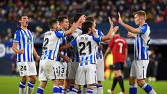 Real Sociedad&#039;s Spanish midfielder Mikel Merino (C) celebrates with teammates after scoring his team&#039;s first goal during the Spanish league football match between CA Osasuna and Real Sociedad at El Sadar stadium in Pamplona on November 7, 2021. 