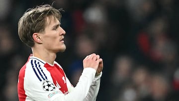 Arsenal's Norwegian midfielder #08 Martin Odegaard celebrates scoring his team's third goal during the UEFA Champions League football match between Arsenal and Dinamo Zagreb at the Emirates Stadium in north London on January 22, 2025. (Photo by JUSTIN TALLIS / AFP)