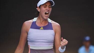 TOPSHOT - Spain's Garbine Muguruza reacts as she plays against Romania's Simona Halep during their women's singles semi-final match on day eleven of the Australian Open tennis tournament in Melbourne on January 30, 2020. (Photo by William WEST / AFP) / IM