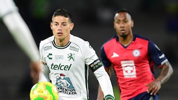 James Rodriguez (L) of Leon fights for the ball with Willer Ditta (R) of Cruz Azul during the 16th round match between Cruz Azul and Leon as part of the Liga BBVA MX, Torneo Clausura 2025 at Olimpico Universitario Stadium, on April 15, 2025 in Mexico City, Mexico.