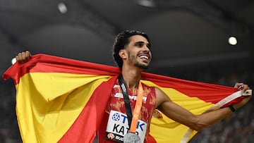 Spain's Mohamed Katir celebrates with his national flag after finishing second in the men's 5000m final during the World Athletics Championships at the National Athletics Centre in Budapest on August 27, 2023. (Photo by Jewel SAMAD / AFP)