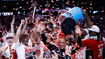 DALLAS, TEXAS - MARCH 31: Head coach Kevin Keatts of the North Carolina State Wolfpack is doused with confetti as players celebrate after the Wolfpack defeated the Duke Blue Devils to advance to the Final Four after the Elite 8 round of the NCAA Men's Basketball Tournament at American Airlines Center on March 31, 2024 in Dallas, Texas.   Carmen Mandato/Getty Images/AFP (Photo by Carmen Mandato / GETTY IMAGES NORTH AMERICA / Getty Images via AFP)