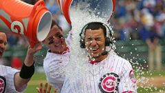 CHICAGO, IL - MAY 08: Javier Baez #9 of the Chicago Cubs is doused with water by David Ross #3 (L) and Anthony Rizzo #44 after hitting a game-winning, walk off home run against the Washington Nationals at Wrigley Field on May 8, 2016 in Chicago, Illinois. The Cubs defeated the Nationals 4-3 in 13 innings.   Jonathan Daniel/Getty Images/AFP
 == FOR NEWSPAPERS, INTERNET, TELCOS &amp; TELEVISION USE ONLY ==