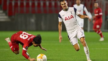Soccer Football - Europa League - Group J - Royal Antwerp v Tottenham Hotspur - Bosuilstadion, Antwerp, Belgium - October 29, 2020 Tottenham Hotspur's Sergio Reguilon in action with Royal Antwerp's Koji Miyoshi REUTERS/Yves Herman