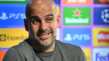 Manchester City's Spanish manager Pep Guardiola reacts as he speaks during a press conference at the Manchester City training ground, in Manchester, north west England, on May 3, 2022, on the eve of their UEFA Champions League semi-final second leg football match against Real Madrid. (Photo by Oli SCARFF / AFP)