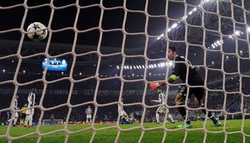 Buffon looks on as Cristiano's acrobatic effort sails into the corner.