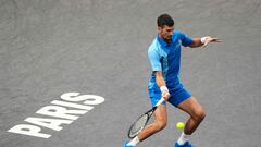 Serbia's Novak Djokovic plays a forehand return to Denmark's Holger Rune during their men's singles quarter-final match on day five of the Paris ATP Masters 1000 tennis tournament at the Accor Arena - Palais Omnisports de Paris-Bercy - in Paris on November 3, 2023. (Photo by Dimitar DILKOFF / AFP)