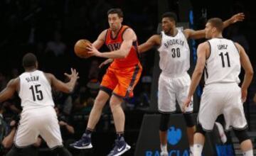 Jan 24, 2016; Brooklyn, NY, USA; Oklahoma City Thunder forward Nick Collison (4) grabs a rebound in front of Brooklyn Nets forward Thaddeus Young (30) and guard Donald Sloan (15) and center Brook Lopez (11) during second half at Barclays Center. The Nets defeated the Thunder  116-106. Mandatory Credit: Noah K. Murray-USA TODAY Sports