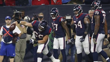 HOUSTON, TX - NOVEMBER 26: Nick Martin #66 of the Houston Texans spikes the ball after a touchdown by Deshaun Watson #4 in the second quarter against the Tennessee Titans at NRG Stadium on November 26, 2018 in Houston, Texas.   Tim Warner/Getty Images/AFP
 == FOR NEWSPAPERS, INTERNET, TELCOS &amp; TELEVISION USE ONLY ==