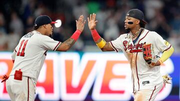 ATLANTA, GEORGIA - AUGUST 22: (L-R) Orlando Arcia #11 and Ronald Acuna Jr. #13 of the Atlanta Braves celebrate a 3-2 win over the New York Mets at Truist Park on August 22, 2023 in Atlanta, Georgia.   Alex Slitz/Getty Images/AFP (Photo by Alex Slitz / GETTY IMAGES NORTH AMERICA / Getty Images via AFP)