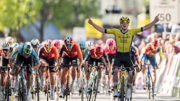 Great Britain's James Brennan (Visma) (R) crosses the finish line to win the first stage of the Tour of Romandie UCI cycling World tour, 194.3 km from Munchenstein to Saint-Imier to Fribourg, on April 29, 2025. (Photo by Fabrice COFFRINI / AFP)