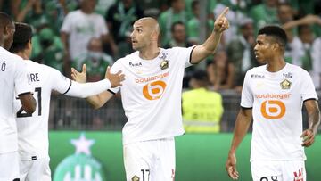 Burak Yilmaz of Lille celebrates his goal with Reinildo Mandava during the French championship Ligue 1 football match between AS Saint-Etienne (ASSE) and Lille OSC (LOSC) on August 21, 2021 at Stade Geoffroy-Guichard in Saint-Etienne, France - Photo Jean 