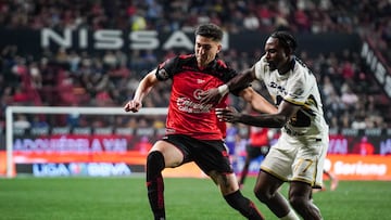 Rafael Fernandez (L) of Tijuana fights for the ball with Alvaro Angulo (R) of Pumas during the 8th round match between Tijuana and Pumas UNAM as part of the Liga BBVA MX Varonil, Torneo Clausura 2026 at Caliente Stadium, on February 27, 2026 in Tijuana, Baja California, Mexico.