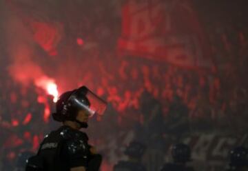 A gendarmerie officer watches a Serbian National soccer league derby match between Partizan and Red Star, in Belgrade, Serbia, Saturday, Sept. 17, 2016. Partizan won 1-0.