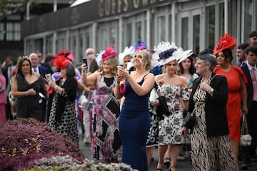 Racegoers attend the second day of the Grand National Festival horse race meeting at Aintree Racecourse in Liverpool, north-west England, on April 12, 2024. (Photo by Oli SCARFF / AFP)