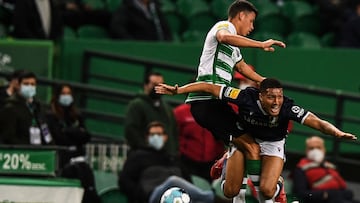 Sporting Lisbon's Brazilian midfielder Matheus Nunes (L) fights for the ball with Famalicao's Swiss midfielder Charles Pickel during the Portuguese league football match between Sporting CP and FC Famalicao at the Jose Alvalade stadium in Lisbon on February 6, 2022. (Photo by PATRICIA DE MELO MOREIRA / AFP)
