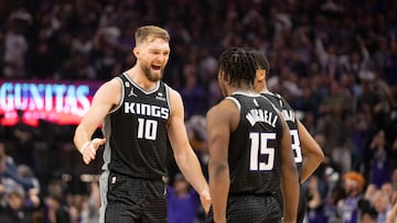 April 17, 2023; Sacramento, California, USA; Sacramento Kings forward Domantas Sabonis (10) celebrates with guard Davion Mitchell (15) against the Golden State Warriors during the second quarter in game two of the second round of the 2023 NBA playoffs at Golden 1 Center. Mandatory Credit: Kyle Terada-USA TODAY Sports