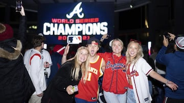 Atlanta Braves fans celebrate near Truist Park, Tuesday, Nov. 2, 2021, in Atlanta. The Atlanta Braves have won their first World Series championship since 1995, hammering the Houston Astros 7-0 in Game 6.  (AP Photo/Rita Harper)