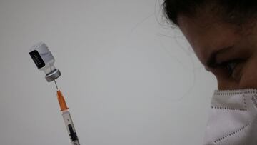 A healthcare worker prepares a Pfizer/BioNtech vaccine against the coronavirus disease during the second booster vaccination program held at a church, in Santiago, Chile, February 7, 2022.