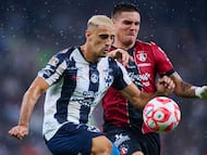 German Berterame (L) of Monterrey fights for the ball with Uros Durdevic (R) of Atlas during the 3rd round match between Monterrey and Atlas as part of the Liga BBVA MX, Torneo Apertura 2025 at BBVA Bancomer Stadium, on July 26, 2025 in Monterrey, Nuevo Leon, Mexico.