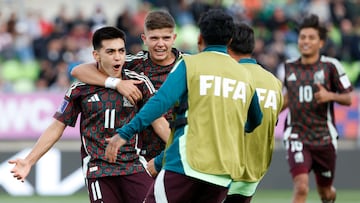 Mexico's midfielder #11 Gilberto Mora (L) celebrates scoring his team's first goal during the 2025 FIFA U-20 World Cup football match between Mexico and Morocco at the Elias Figueroa Stadium in Valparaiso, Chile on October 4, 2025. (Photo by Raul BRAVO / AFP)