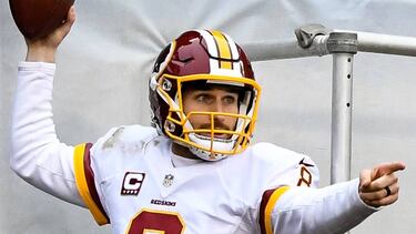 CHICAGO, IL - DECEMBER 24: Quarterback Kirk Cousins #8 of the Washington Redskins reacts after carrying the football into the endzone for a touchdown in the second quarter at Soldier Field on December 24, 2016 in Chicago, Illinois. David Banks/Getty Images/AFP
== FOR NEWSPAPERS, INTERNET, TELCOS & TELEVISION USE ONLY ==