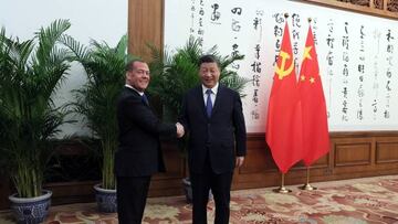 Deputy head of Russia's Security Council and chairman of the United Russia party, Dmitry Medvedev (L) shakes hands with Chinese President Xi Jinping during their meeting in Beijing, on December 21, 2022. (Photo by Yekaterina SHTUKINA / Sputnik / AFP) (Photo by YEKATERINA SHTUKINA/Sputnik/AFP via Getty Images)