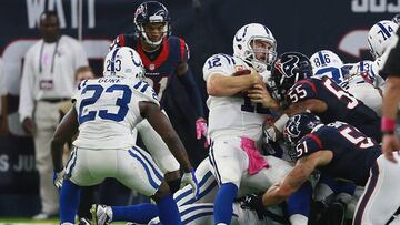 HOUSTON, TX - OCTOBER 16: Andrew Luck #12 of the Indianapolis Colts is stopped by Benardrick McKinney #55 of the Houston Texans and John Simon #51 in the fourth quarter at NRG Stadium on October 16, 2016 in Houston, Texas.   Bob Levey/Getty Images/AFP
 == FOR NEWSPAPERS, INTERNET, TELCOS &amp; TELEVISION USE ONLY ==