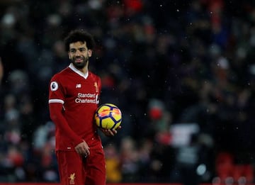 Hats off | Liverpool's Mohamed Salah celebrates with the match ball.