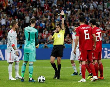 Referee Antonio Cunha disallows Iran goal after consulting with the VAR.