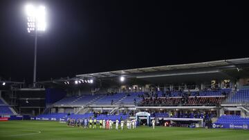 HUESCA, SPAIN - APRIL 09: Players line up ahead of the La Liga Santader match between SD Huesca and Elche CF at Estadio El Alcoraz on April 09, 2021 in Huesca, Spain. Sporting stadiums around Spain remain under strict restrictions due to the Coronavirus
