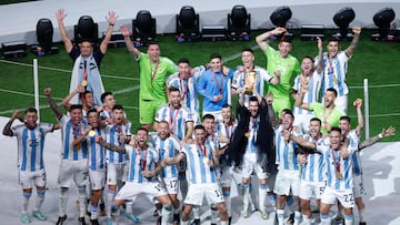 Argentina's forward #10 Lionel Messi lifts the World Cup trophy during the Qatar 2022 World Cup trophy ceremony after the football final match between Argentina and France at Lusail Stadium in Lusail, north of Doha on December 18, 2022. - Argentina won in the penalty shoot-out. (Photo by Odd ANDERSEN / AFP)