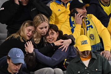 Swedish supporters react as they wait in the stand during the Euro 2024 qualifying football match between Belgium and Sweden at the King Baudouin Stadium in Brussels on October 16, 2023, after an 'attack' that targeted Swedish citizens in a street of Brussels. Belgian federal prosecutor leading on terrorism cases launched an investigation into an attack that left two dead in Brussels on October 16, 2023 evening, a spokesman told AFP. Belgium PM slams Brussels 'attack' targeting Swedish citizens. (Photo by JOHN THYS / AFP)