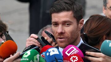 Spain's soccer player Xabi Alonso talks to the media as he leaves after appearing in court on a trial for tax fraud in Madrid, Spain, January 22, 2019. REUTERS/Sergio Perez