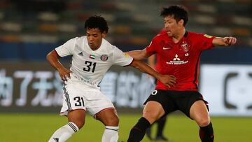 Soccer Football - FIFA Club World Cup - Al Jazira vs Urawa Red Diamonds - Zayed Sports City Stadium, Abu Dhabi, United Arab Emirates - December 9, 2017   Al Jazira&rsquo;s Romarinho in action with Urawa Red Diamonds&rsquo; Takuya Aoki        REUTERS/Amr Abdallah Dalsh