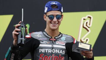 MotoGP - Catalunya Grand Prix - Circuit de Barcelona-Catalunya, Barcelona, Spain - September 27, 2020. Petronas Yamaha SRT&#039;s Fabio Quartararo poses with a trophy on the podium as he celebrates after winning the race. REUTERS/Albert Gea