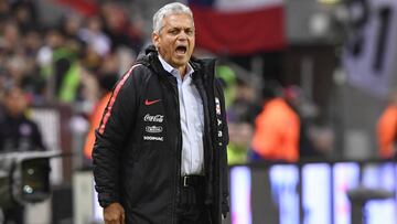 Chile's head coach Reinaldo Rueda watches the international friendly soccer match between Sweden and Chile at Friends Arena in Solna, Stockholm, Saturday March 24, 2018. (Anders Wiklund/TT via AP)