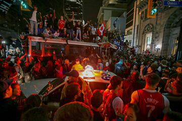 REFILE - QUALITY REPEAT Fans celebrate in the streets of Toronto, Canada after the Toronto Raptors win the NBA Championship in Toronto, Ontario, Canada, June 13, 2019.  