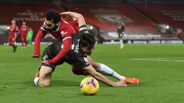 LIVERPOOL, ENGLAND - JANUARY 17: (THE SUN OUT,THE SUN ON SUNDAY OUT) Mohamed Salah of Liverpool with Manchester United's Harry Maguire during the Premier League match between Liverpool and Manchester United at Anfield on January 17, 2021 in Liverpoo