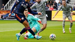 FC Cincinnati forward Brandon Vázquez, left, scores during the first half of an MLS soccer match against CF Montreal, Saturday, April 2, 2022, in Cincinnati. (AP Photo/Jeff Dean)