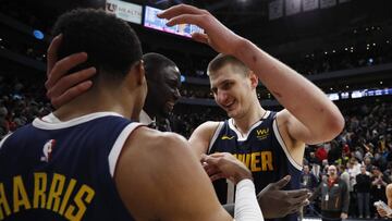 Feb 5, 2020; Salt Lake City, Utah, USA; Denver Nuggets center Nikola Jokic (15), right celebrates with guard Gary Harris (14) after their win against the Utah Jazz at Vivint Smart Home Arena. Mandatory Credit: Jeffrey Swinger-USA TODAY Sports