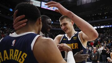 Feb 5, 2020; Salt Lake City, Utah, USA;  Denver Nuggets center Nikola Jokic (15), right celebrates with guard Gary Harris (14) after their win against the Utah Jazz at Vivint Smart Home Arena. Mandatory Credit: Jeffrey Swinger-USA TODAY Sports