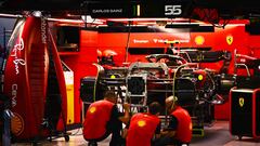 SINGAPORE, SINGAPORE - SEPTEMBER 29: The Ferrari team work in the garage during previews ahead of the F1 Grand Prix of Singapore at Marina Bay Street Circuit on September 29, 2022 in Singapore, Singapore. (Photo by Clive Mason/Getty Images,)